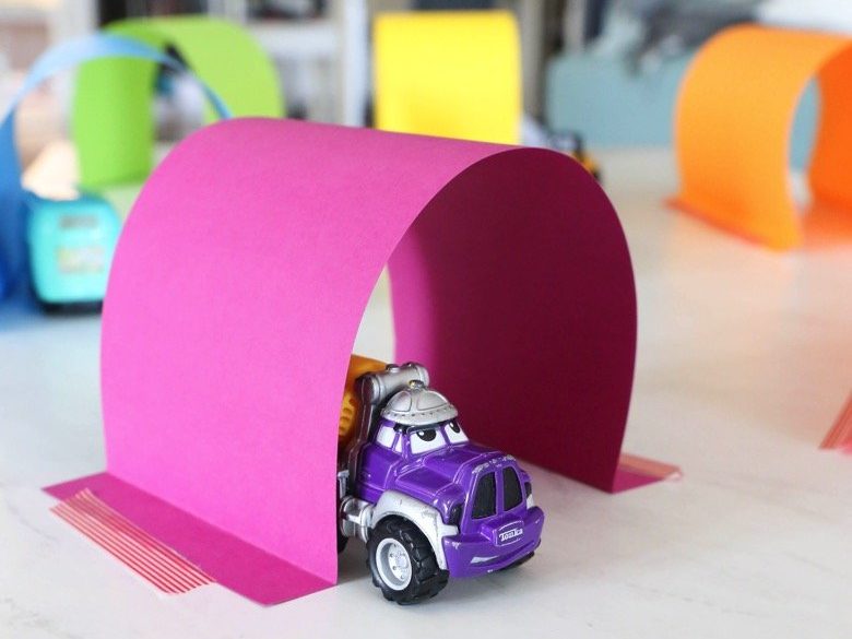 Pink paper tunnel with a toy truck