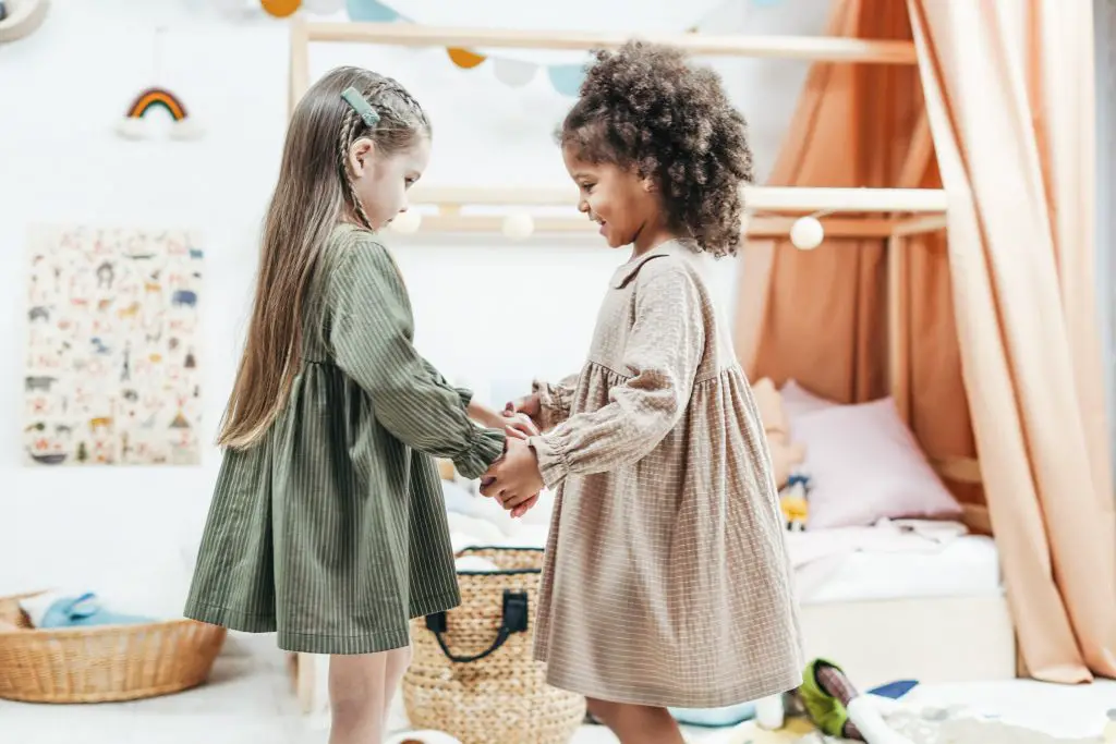 two little girls holding hands