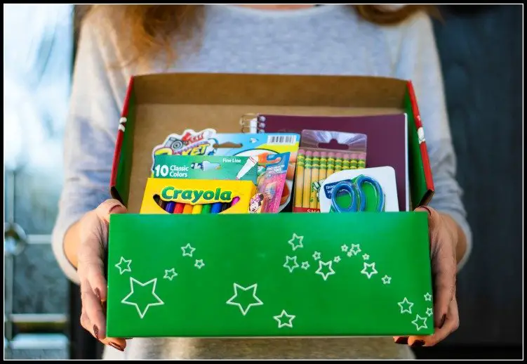 a box with different school supplies