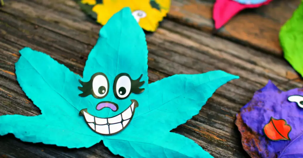 painted, smiling leaf monster