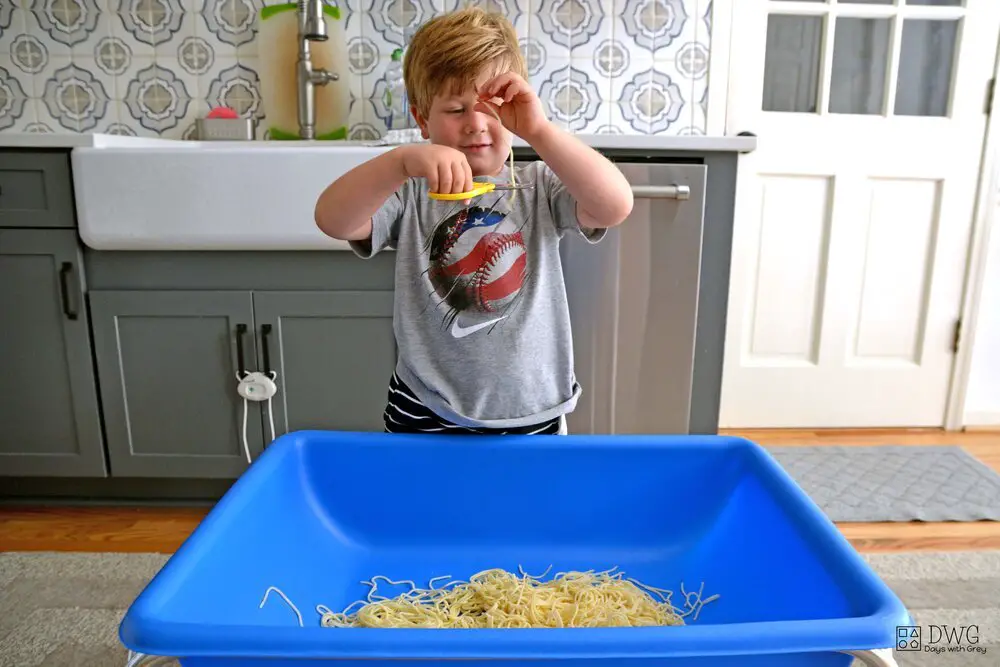 Kid cutting spaghetti