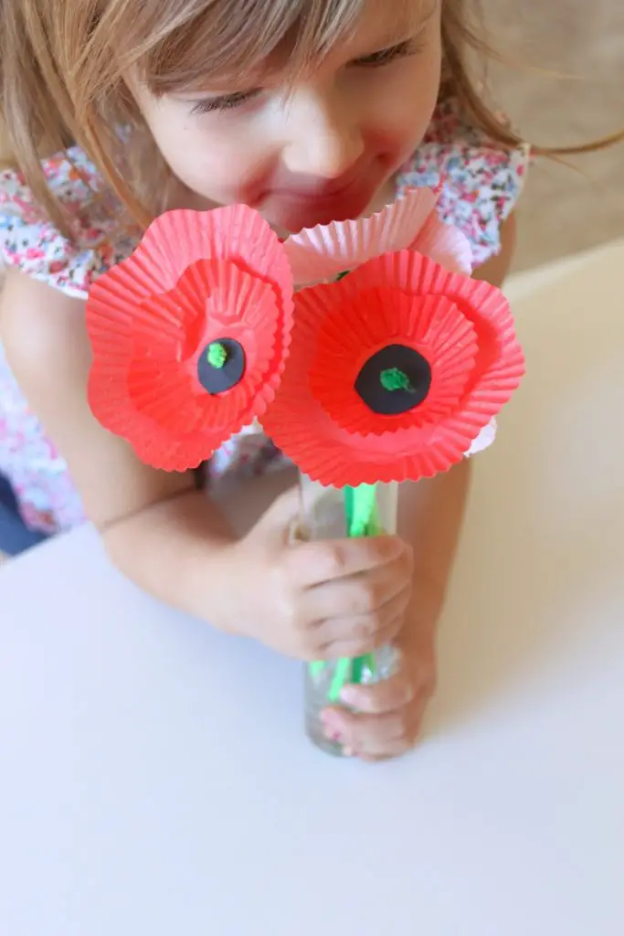 Girl holding a Cupcake-Liner Poppy Bouquet